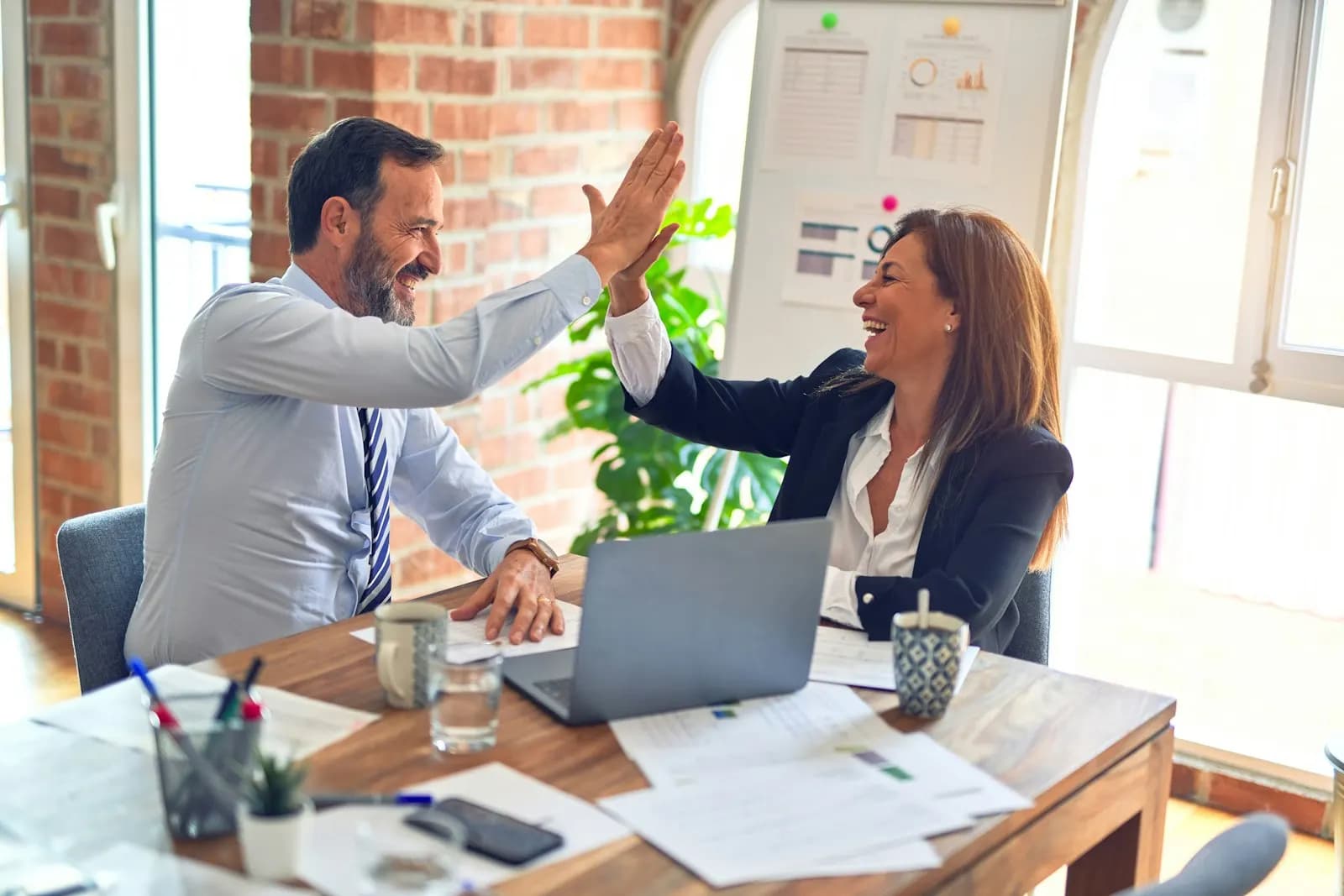 DMAS consultants collaborating on client financials
